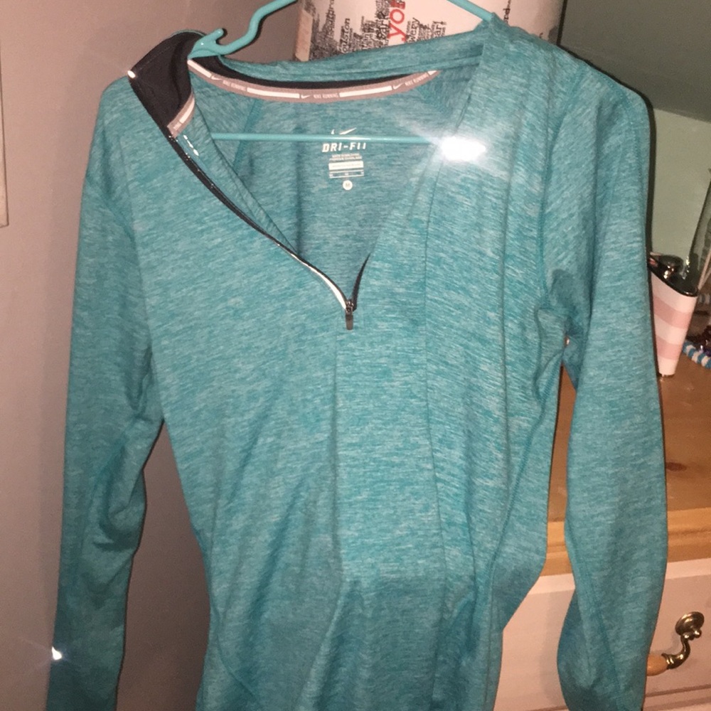 Selling this medium blue/green Nike zip up!